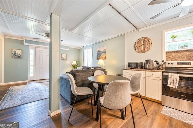 4297 Earney Rd, Woodstock, GA 30188 - dining space featuring a ceiling fan, light wood finished floors, and crown molding