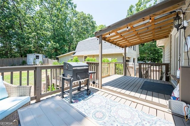 wooden deck featuring a shed