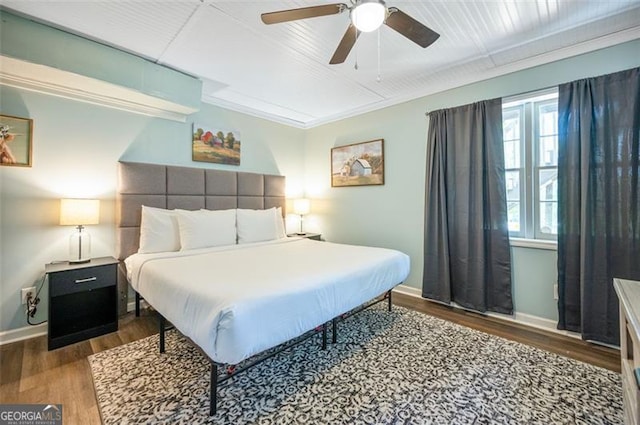 bedroom with ceiling fan and dark hardwood / wood-style flooring