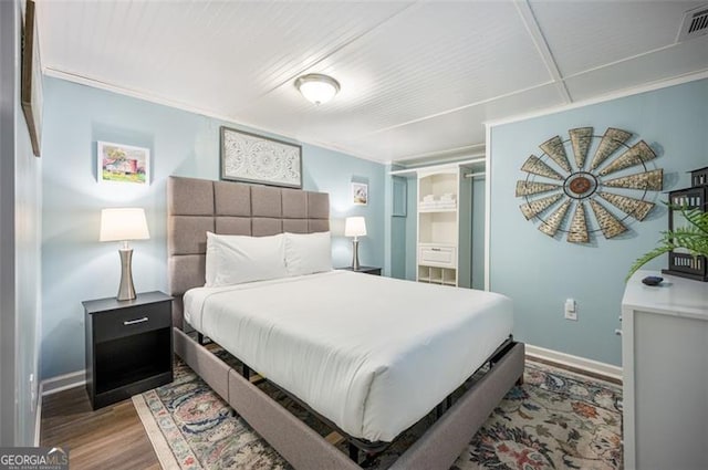 bedroom with hardwood / wood-style flooring