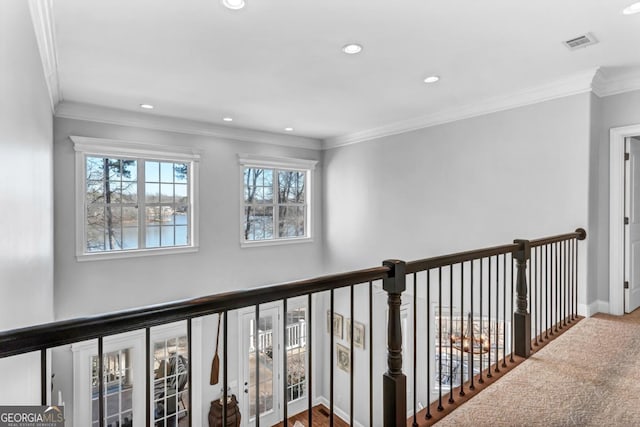 corridor featuring crown molding and a water view