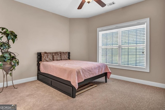 carpeted bedroom featuring ceiling fan