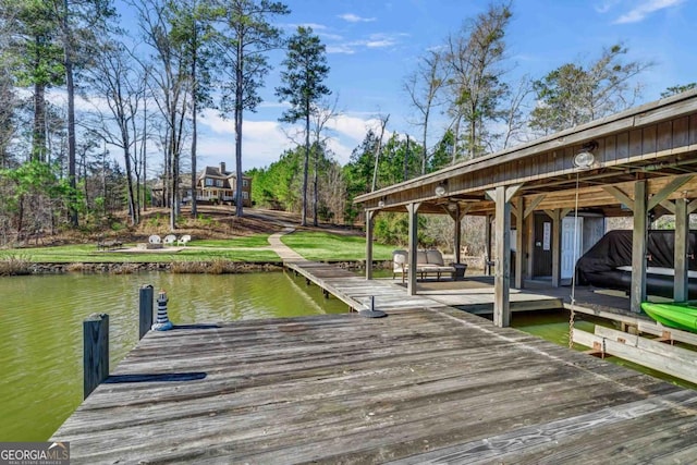 dock area with a water view