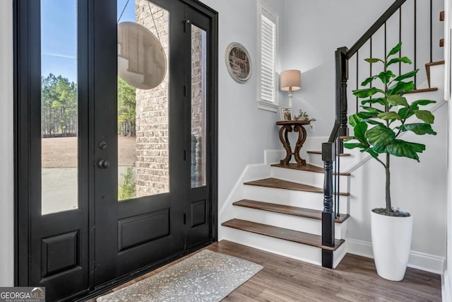 entryway with wood-type flooring