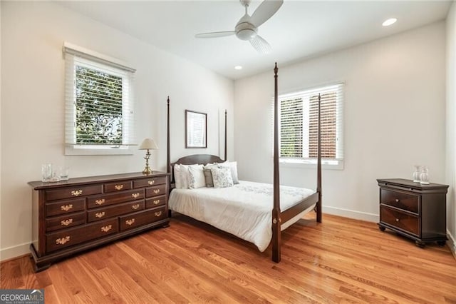 bedroom with ceiling fan and light wood-type flooring