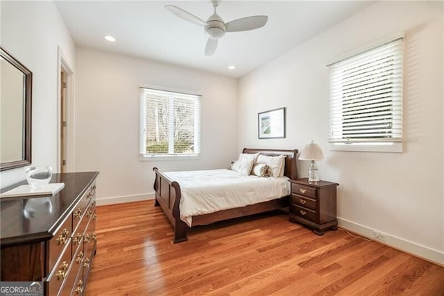 bedroom with ceiling fan and light wood-type flooring