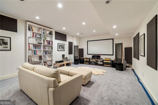 home theater room with light carpet