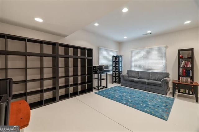 living room featuring concrete floors