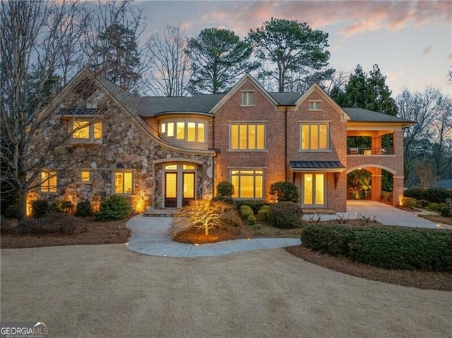 view of front of property featuring a carport