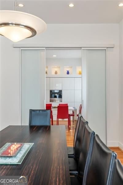 dining area with wood-type flooring