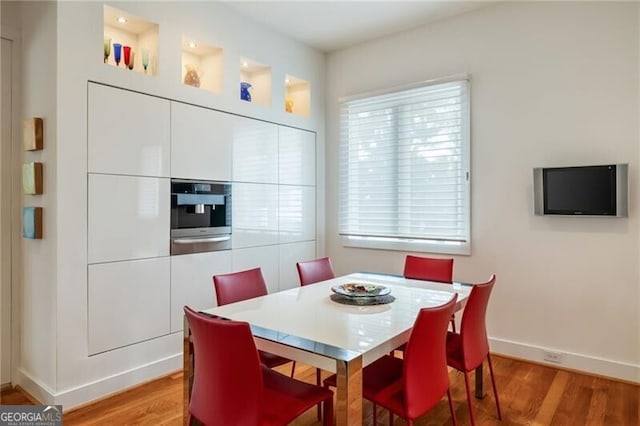 dining room with hardwood / wood-style flooring