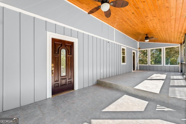 entrance to property with ceiling fan