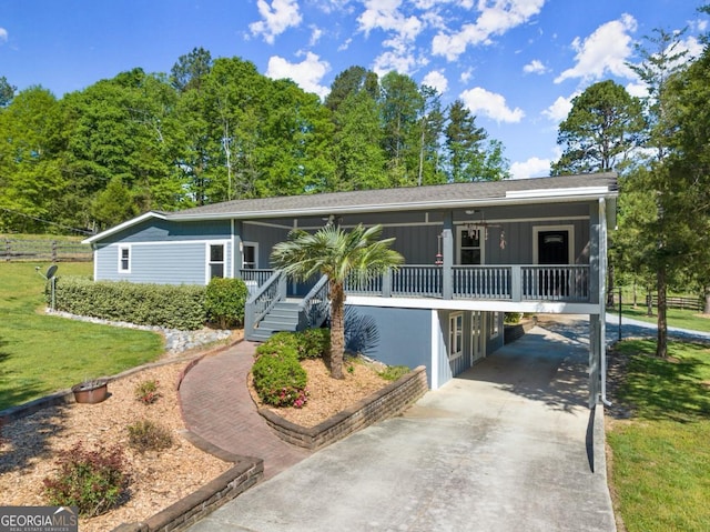 single story home with a front yard and covered porch