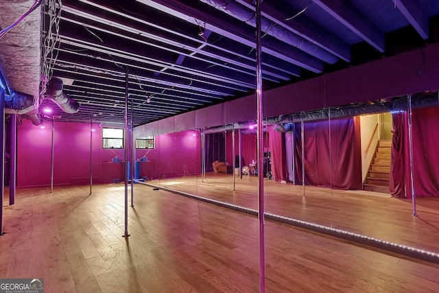 basement featuring hardwood / wood-style flooring