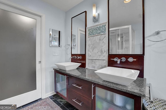 bathroom with tasteful backsplash, tile patterned floors, and vanity