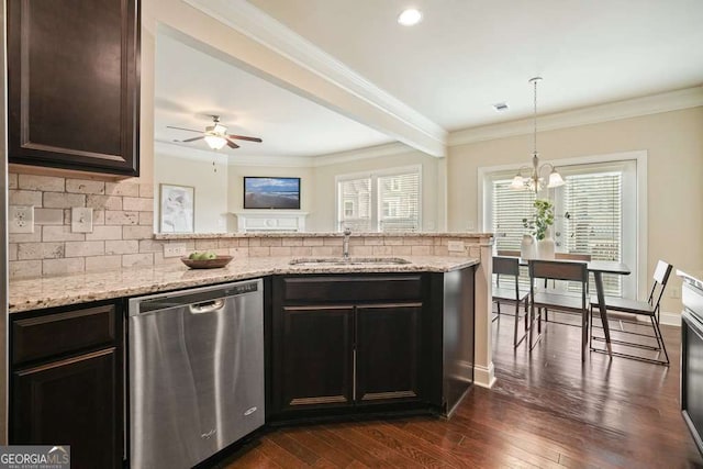 kitchen featuring crown molding, dark brown cabinets, a healthy amount of sunlight, and stainless steel dishwasher