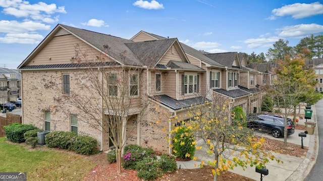 townhome / multi-family property featuring a garage