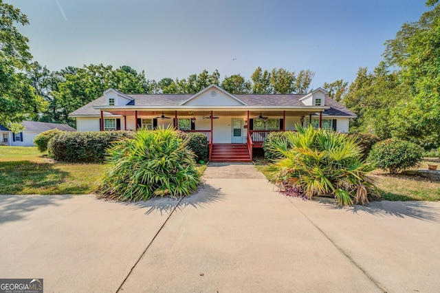 ranch-style home with a porch, concrete driveway, and ceiling fan