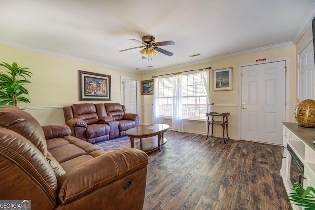 living area featuring visible vents, crown molding, baseboards, ceiling fan, and dark wood-style flooring