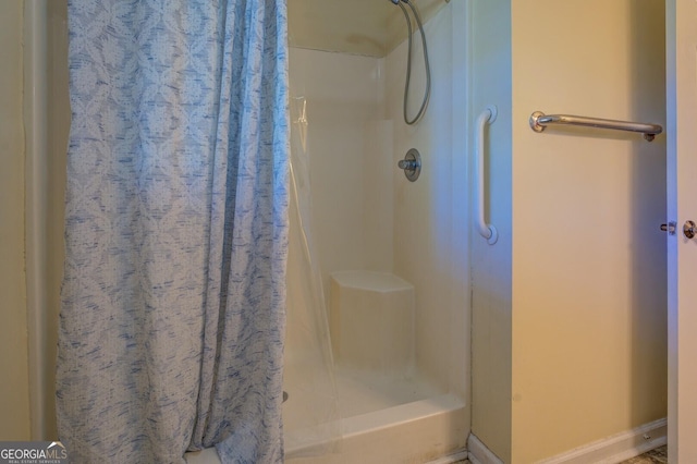 full bathroom featuring a shower stall