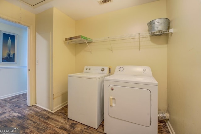 washroom with laundry area, baseboards, dark wood-style flooring, and washer and clothes dryer