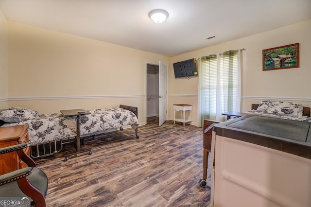 bedroom with wood-type flooring