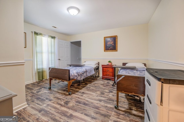 bedroom featuring hardwood / wood-style floors