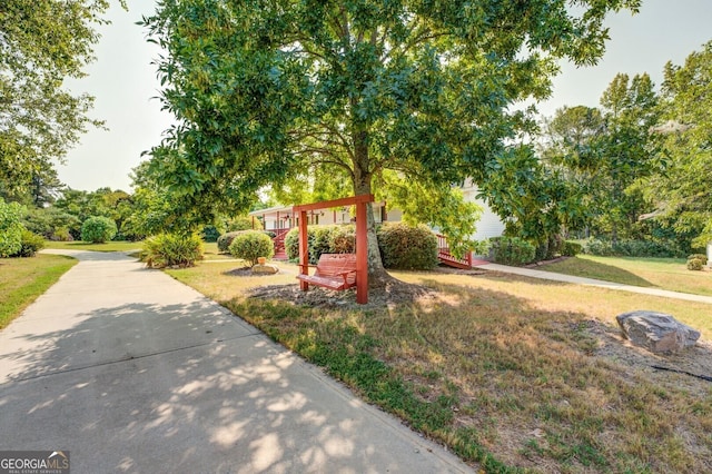 view of community featuring a yard