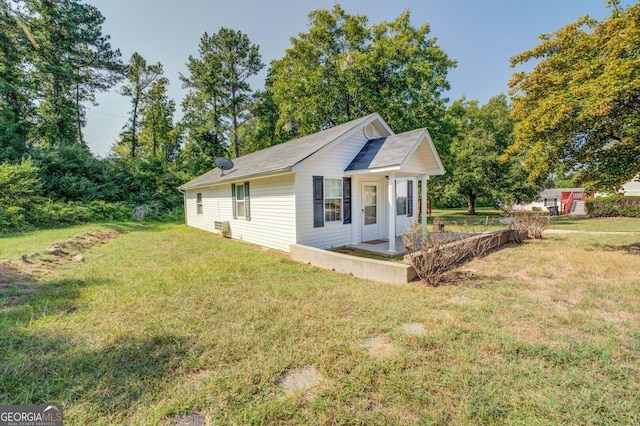 view of property exterior with a lawn