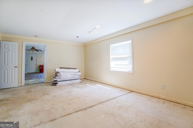 interior space featuring crown molding and ceiling fan