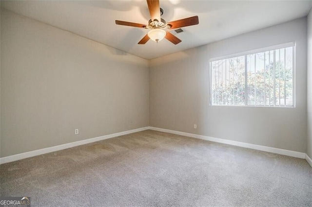 carpeted empty room with ceiling fan