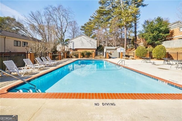 view of swimming pool with a patio area