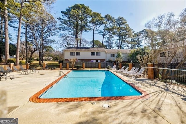 view of swimming pool featuring a patio area