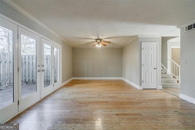 unfurnished room with french doors, ceiling fan, ornamental molding, and light hardwood / wood-style flooring