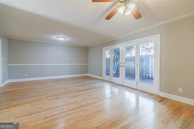 unfurnished room with ornamental molding, ceiling fan, light hardwood / wood-style floors, and french doors