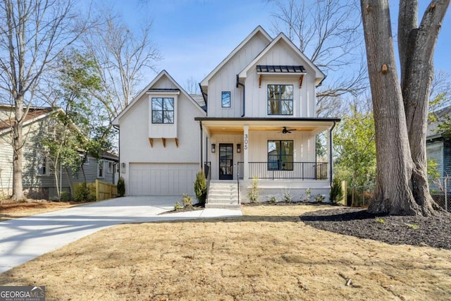 modern inspired farmhouse with a garage and a porch