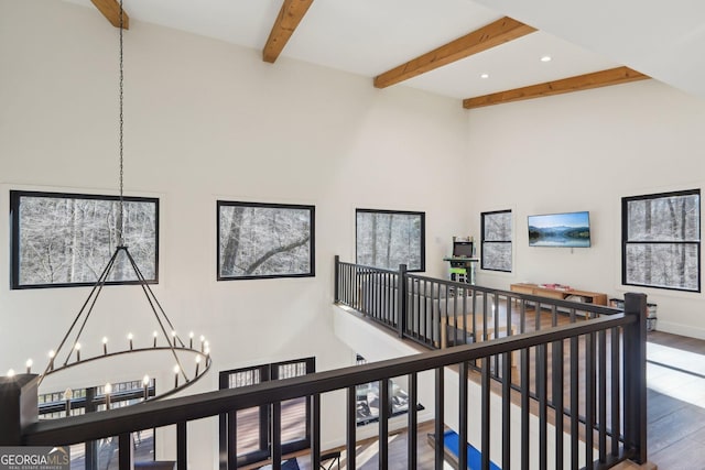 581 Etowah Trl, Dahlonega, GA 30533 - corridor with an upstairs landing, a chandelier, wood finished floors, a towering ceiling, and beam ceiling