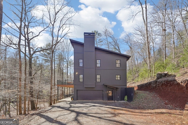 view of side of property featuring a garage