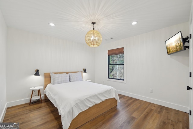 bedroom featuring dark hardwood / wood-style flooring