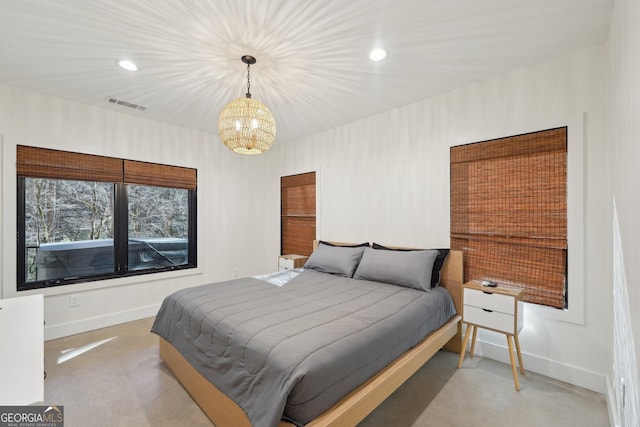 bedroom featuring a chandelier