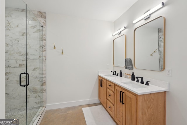 bathroom with vanity and a shower with shower door