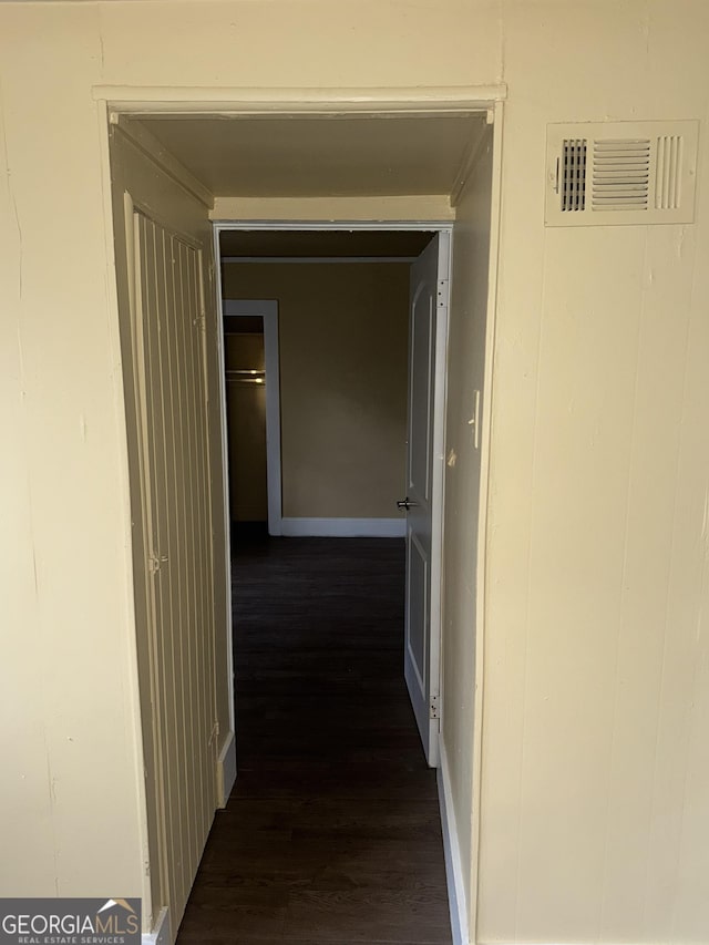 hall with dark wood-type flooring