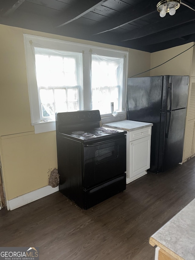 kitchen with beamed ceiling, wooden ceiling, dark hardwood / wood-style flooring, and black appliances