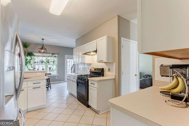 kitchen featuring pendant lighting, gas stove, white cabinets, light tile patterned flooring, and stainless steel fridge with ice dispenser