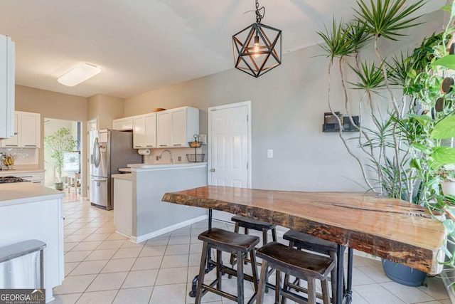 dining area featuring light tile patterned floors