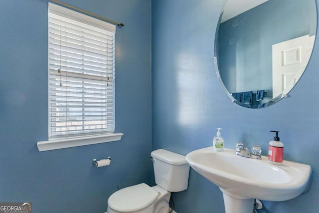 bathroom with toilet and sink