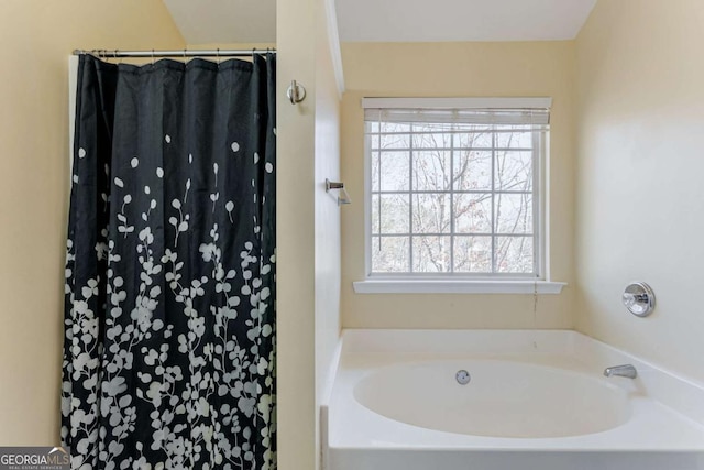 bathroom featuring a tub