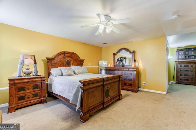 bedroom with light colored carpet and ceiling fan