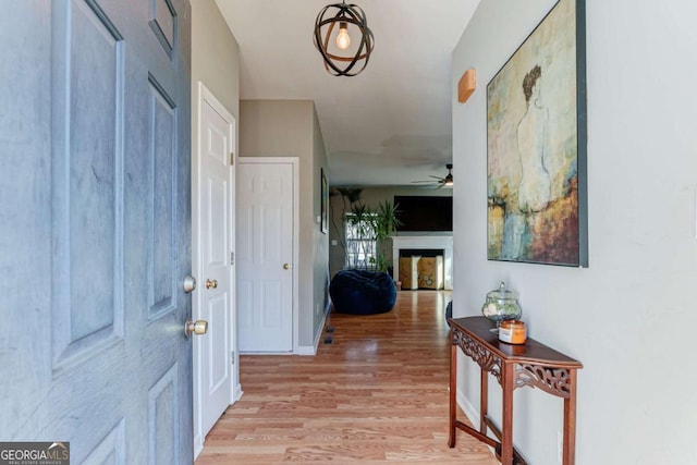 entryway featuring ceiling fan and light hardwood / wood-style floors