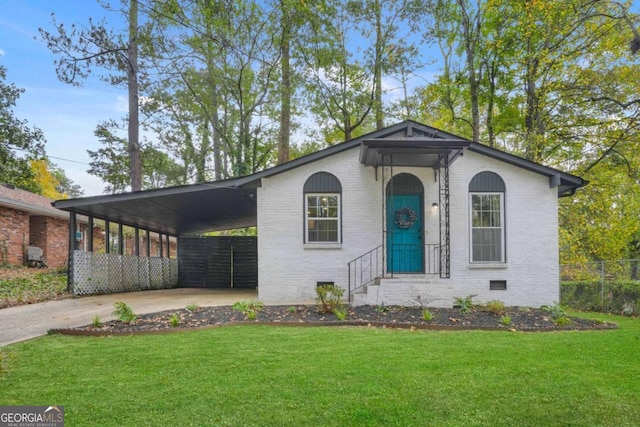 ranch-style house with a carport and a front yard